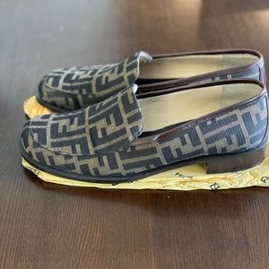 FENDI Zucca flat loafers in black and sand.